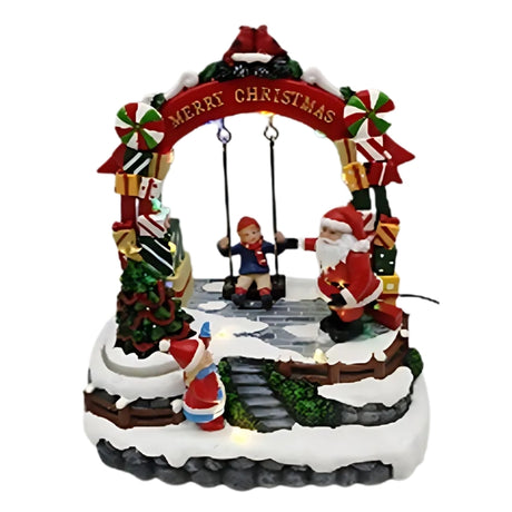 Decorazione Natalizia con Bambino su Altalena e Albero Luminoso