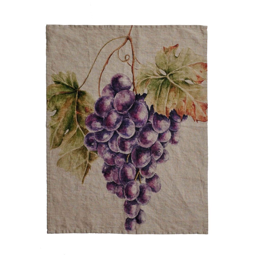 Canovaccio in lino naturale con disegno ad acquarelli di un grappolo d'uva rossa.