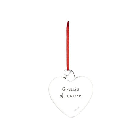 Pallina a forma di cuore in vetro con scritta "grazie di cuore" e nastrino rosso.
