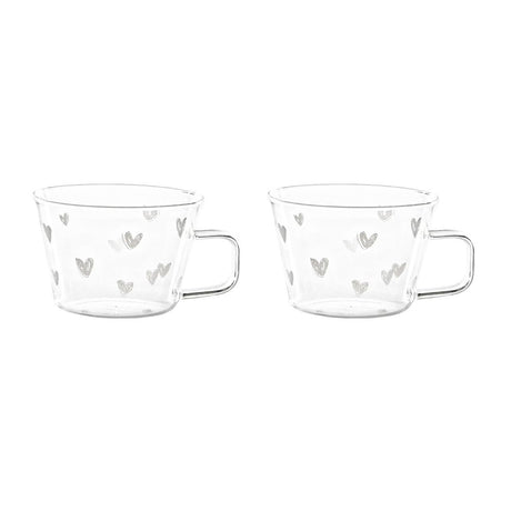 Set di due tazze in vetro con capienza di 280 ml e decorare con cuoricini bianchi.