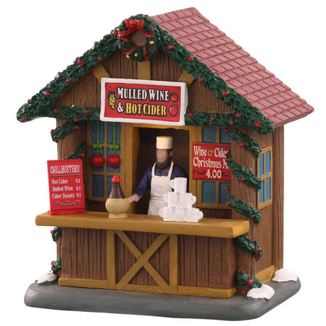 Chiosco natalizio con insegna “Mulled Wine & Hot Cider” e venditore. 