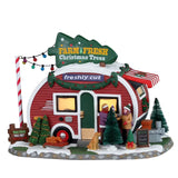 Roulotte rossa con insegna verde "Farm Fresh Christmas Trees" adibita per la vendita di alberi con decorazioni natalizie e due personaggi.