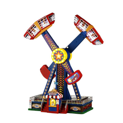 Giostra da luna park in miniatura per villaggetti natalizi su fondo bianco. 