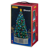Confezione dell'albero di Natale musicale Lemax con Bluetooth, decorato con luci multicolore e base decorativa.
