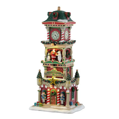 Torre dell’orologio natalizia decorata con ghirlande, soldatini, regali e figura di Babbo Natale.