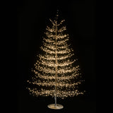 Albero decorativo natalizio alto 210cm con rami sottili illuminato da micro LED bianco caldo su sfondo nero.