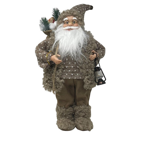 Figura decorativa di Babbo Natale in abiti beige con maglione lavorato, barba bianca, lanterna in mano e sacco con rami e pacchi regalo, alto 45cm. 