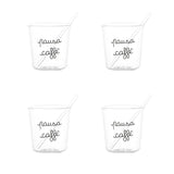 Set di quattro bicchierini in vetro trasparente con scritta nera "pausa caffè" e palettine incluse.