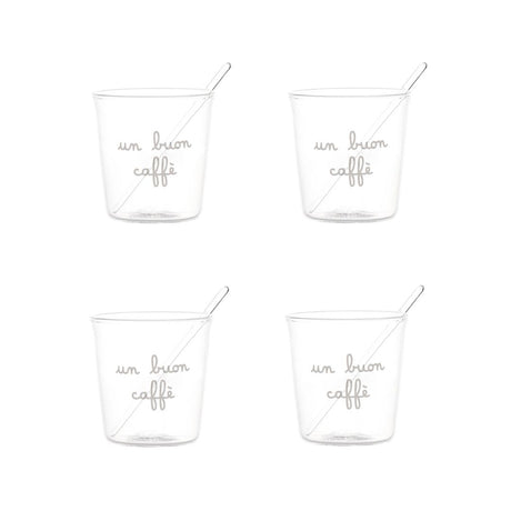 Set di quattro bicchierini in vetro trasparente con scritta bianca in corsivo "un buon caffè" e palettine incluse.