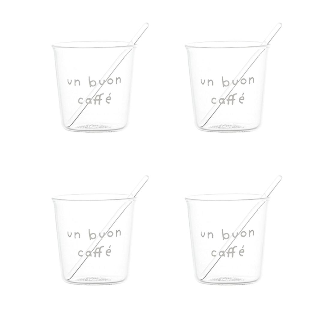 Set di quattro bicchierini in vetro trasparente con scritta bianca “un buon caffè” in stampatello e palettine incluse.