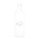 Bottiglia con tappo in vetro borosilicato con scritta bianca "H2O".