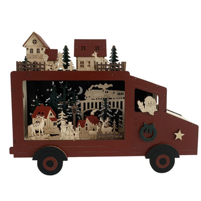 Camioncino natalizio decorativo in legno con scena illuminata: Babbo Natale alla guida, case e abeti sul tetto e paesaggio invernale con renne, pupazzo di neve e trenino sullo sfondo.