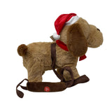 Cane peluche marrone con cappello e sciarpa rossi natalizi, dotato di guinzaglio con comando per musica e movimento fotografato lateralmente.