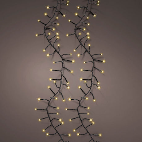 Catena luminosa da 1272 micro LED color champagne con cavo nero su sfondo scuro.