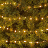 Catena con micro LED bianco caldo alternati a piccole sfere di 1 cm di diametro bianco caldo.