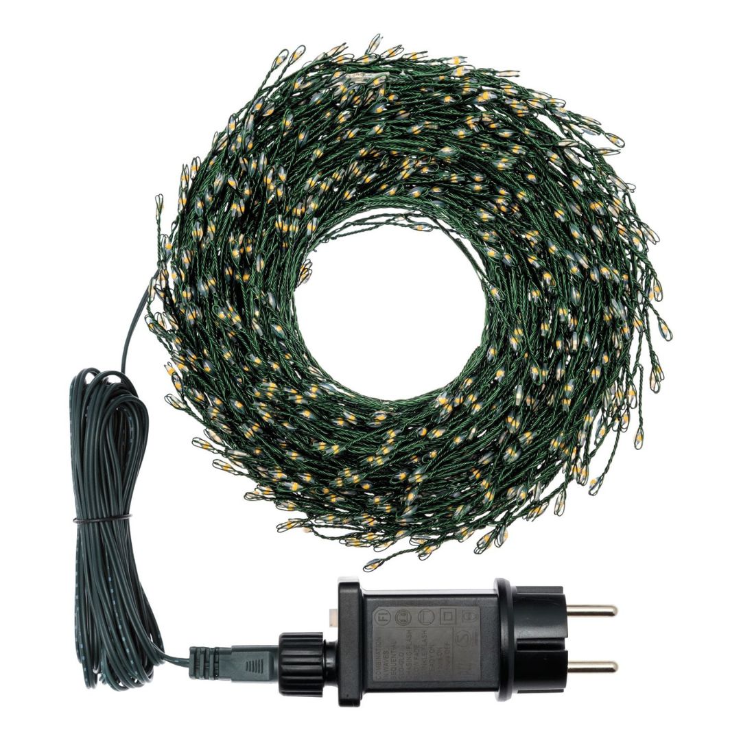 Bobina di minicluster cavo verde con trasformatore su sfondo bianco.