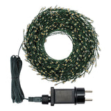 Bobina di minicluster cavo verde con trasformatore su sfondo bianco.