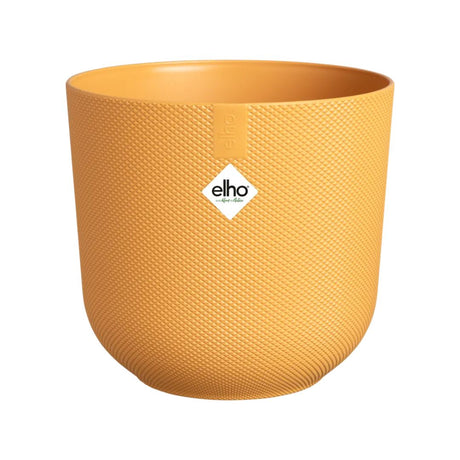Piccolo coprivaso in plastica riciclata di colore giallo con diametro 11 cm.