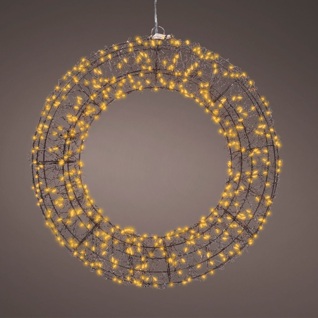 Ghirlanda luminosa da 38 cm accesa, appesa su sfondo marrone, con luci LED calde ben distribuite.