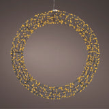 Ghirlanda luminosa da 58 cm accesa, sospesa su sfondo marrone, con microled caldi.