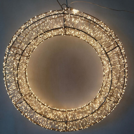 Corona decorativa luminosa con micro LED bianco caldo su struttura metallica circolare diametro 58 cm.