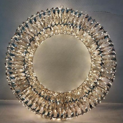 Corona decorativa luminosa con struttura circolare in PET iridescente e micro LED bianco caldo con diametro 40cm.