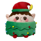 Cuscino a forma di elfo natalizio vestito di verde con cappello con una stella sulla punta.