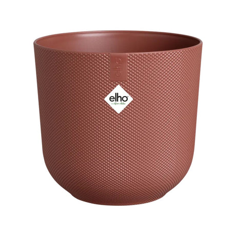 Coprivaso in plastica riciclata di colore rosso con diametro 26 cm.
