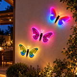 Tre farfalle LED colorate 40 cm ambientate su parete esterna