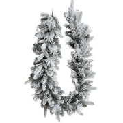 Festone natalizio decorativo innevato lungo 180 cm su sfondo bianco.