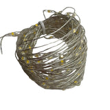 Filo luminoso in metallo argentato con 200 micro LED a luce bianco caldo avvolto e spento.