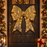 Fiocco natalizio oro da 87 cm con LED bianco caldo appeso alla porta d'ingresso decorata per Natale