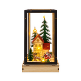 Lanterna natalizia Garden Team in legno con cornice nera, casetta, abeti innevati, Babbo Natale sulla slitta e luci LED calde
