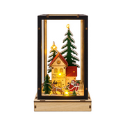 Lanterna natalizia Garden Team in legno con cornice nera, casetta, abeti innevati, Babbo Natale sulla slitta e luci LED calde