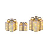 Tre pacchi regalo natalizi luminosi da 13, 18 e 23 cm con fiocchi argentati e LED bianco caldo