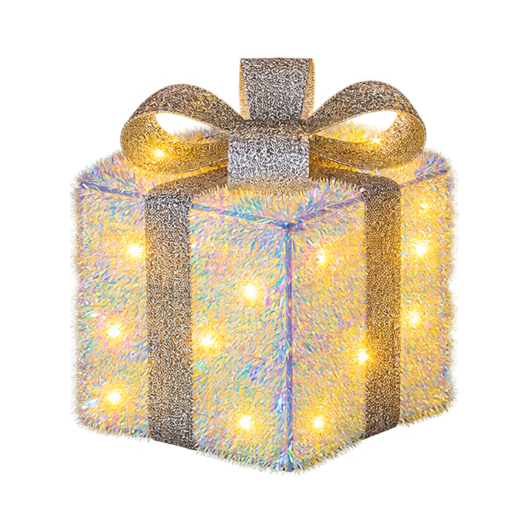 Pacco regalo natalizio luminoso alto 18 cm con superficie iridescente, fiocco argentato e LED bianco caldo