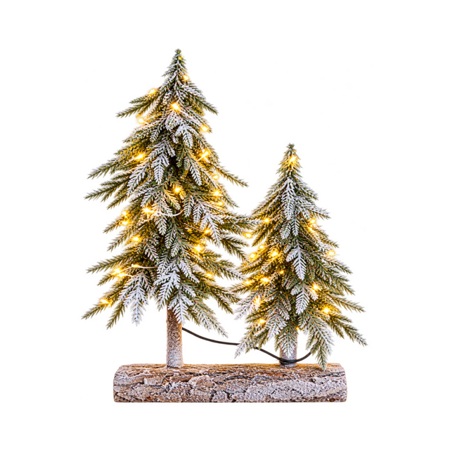 Due pini natalizi innevati Garden Team di diverse altezze, con luci LED bianco caldo e base comune in legno.