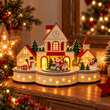 Villaggio natalizio luminoso in legno con casette, trenino e Babbo Natale, ambientato su un mobile tra luci e addobbi natalizi