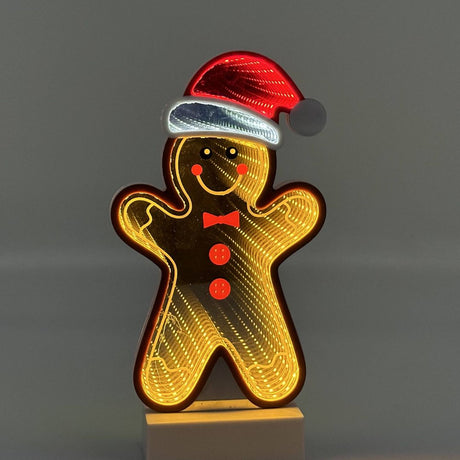 Decorazione luminosa natalizia a forma di omino pan di zenzero con cappello di Babbo Natale ed effetto ottico Infinity Light.