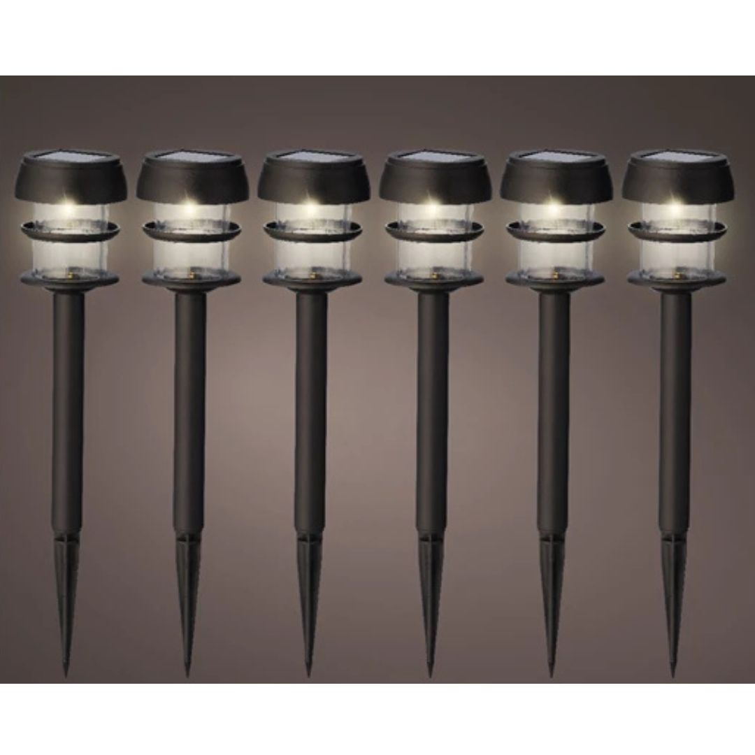 Set di 6 lampade solari da giardino con picchetto e luce bianca calda, sfondo neutro