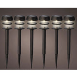 Set di 6 lampade solari da giardino con picchetto e luce bianca calda, sfondo neutro