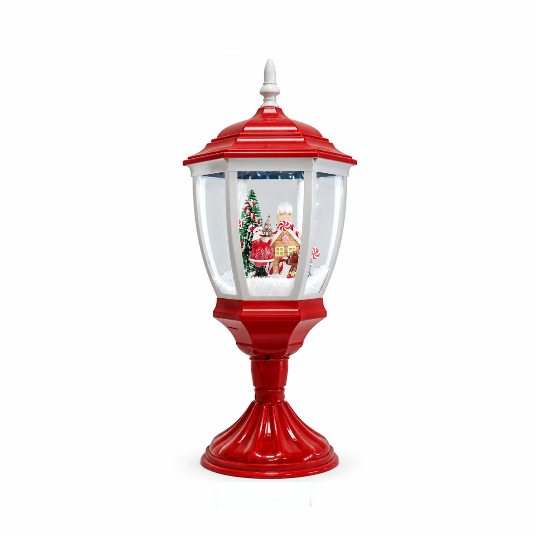Lanterna natalizia da tavolo rossa e bianca con scena innevata, Babbo Natale, casetta di pan di zenzero e albero decorato