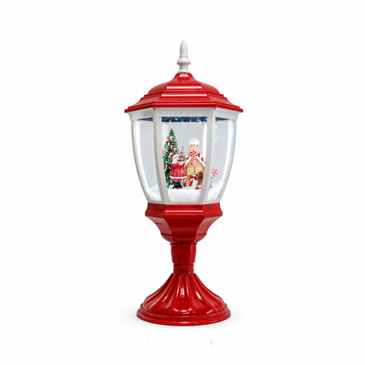 Lanterna natalizia da tavolo rossa e bianca con scena innevata, Babbo Natale, casetta di pan di zenzero e albero decorato