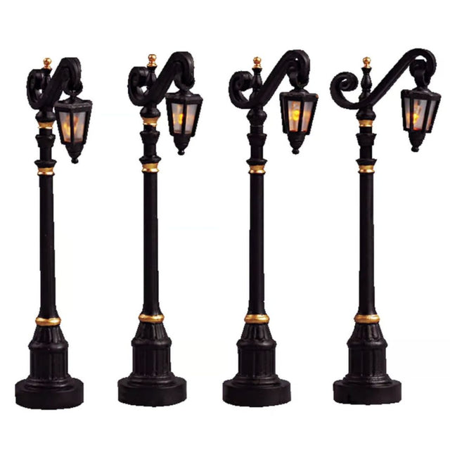 Set di quattro lampioni Lemax per villaggetti natalizi.