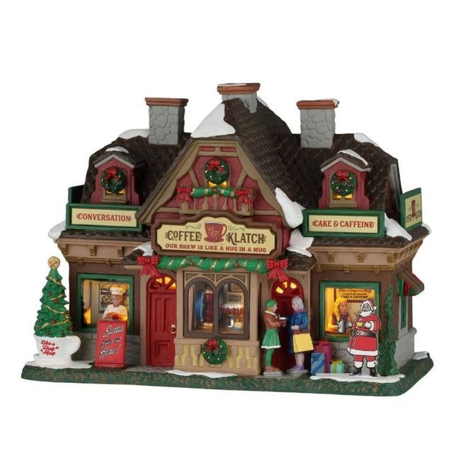 Coffee Klatch Lemax, caffetteria natalizia innevata e illuminata, decorata con ghirlande e fiocchi rossi, con clienti all’ingresso e albero di Natale.