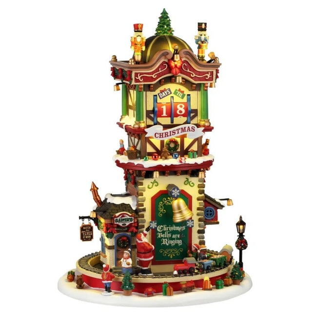 Torre natalizia Lemax decorata con schiaccianoci, campane, regali e albero di Natale, con conto alla rovescia dei giorni fino a Natale e trenino alla base.