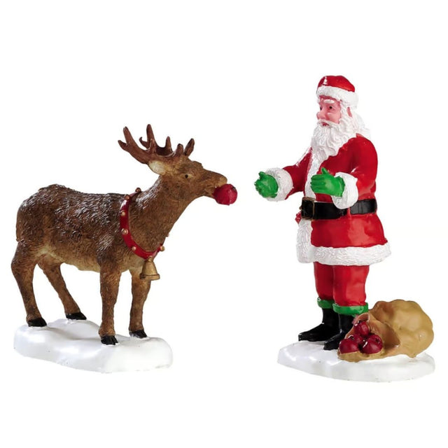 Set di due personaggi Lemax con Babbo Natale che da una mela alla sua renna.
