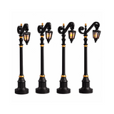 Set di quattro lampioni Lemax per villaggetti natalizi.