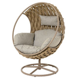 Poltrona girevole da esterno a nido con struttura in metallo, intreccio in fibra color naturale e cuscini imbottiti beige.