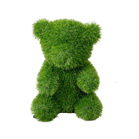Orso decorativo seduto in prato sintetico verde 20x35cm.